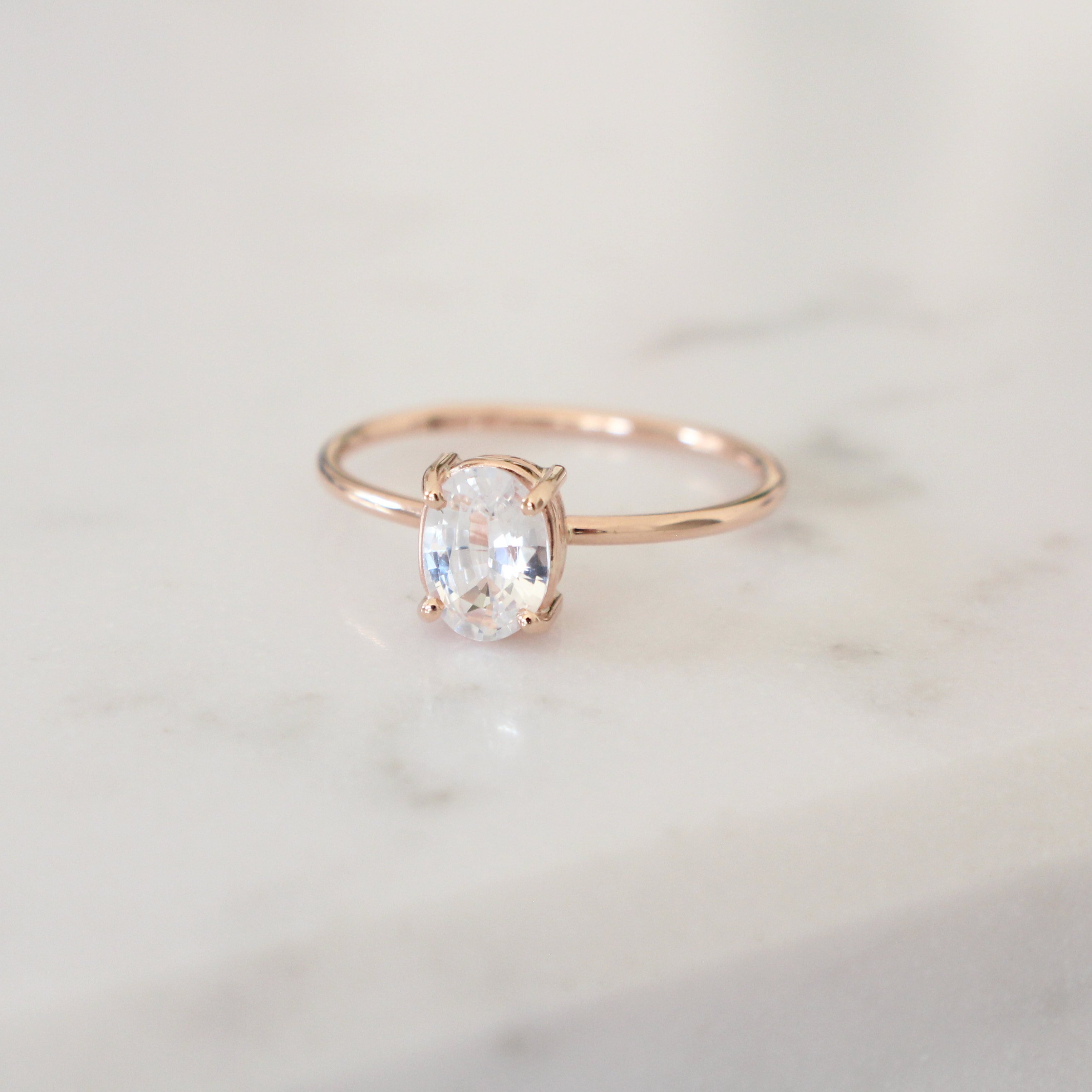 Elegant White Sapphire Ring with Halo Design - Size 7